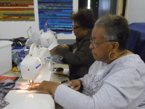 two ladies at their sewing machines